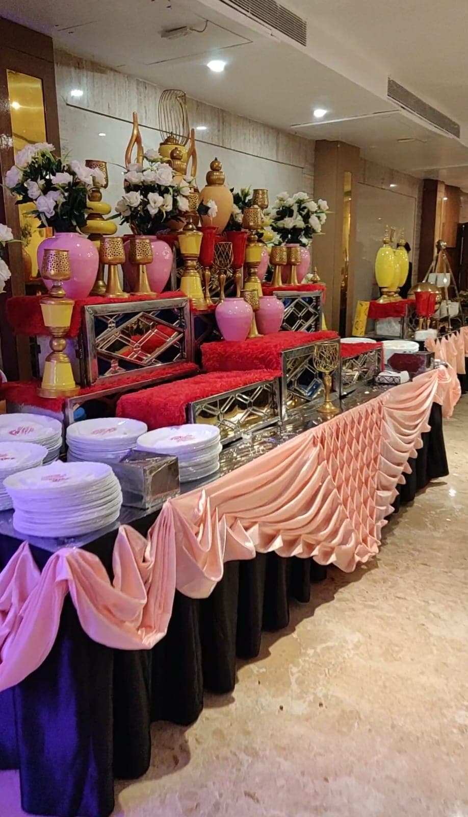 Elegant catering display with decorative urns